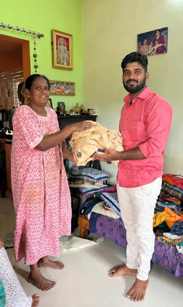 Old pattu saree buyers near me — customer handing over a golden silk saree
