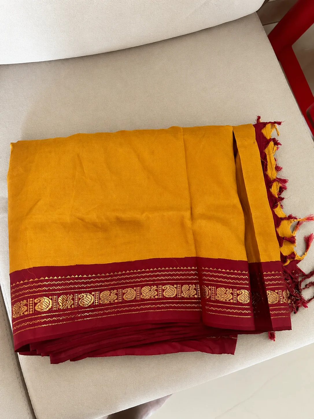 Old handloom silk saree buyers — mustard silk saree with peacock motif border