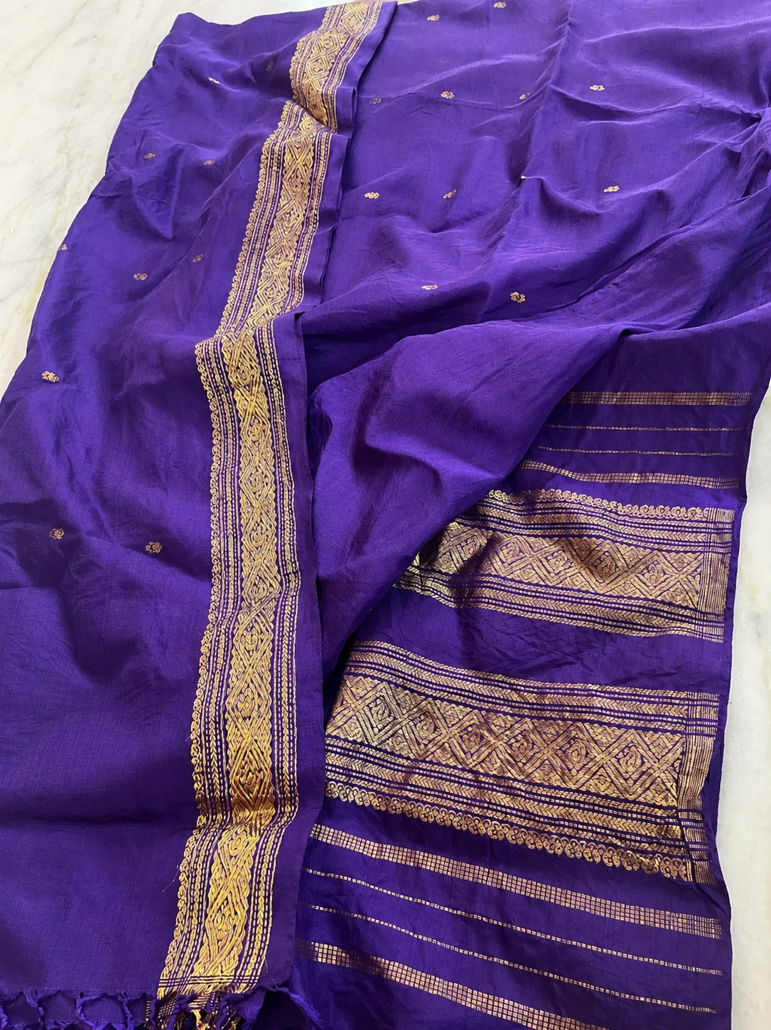 Old zari saree buyers — deep purple silk saree with gold zari border and floral butis